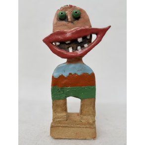 Grinedreng med gr�nne �jne, skulptur, ca. 23 cm